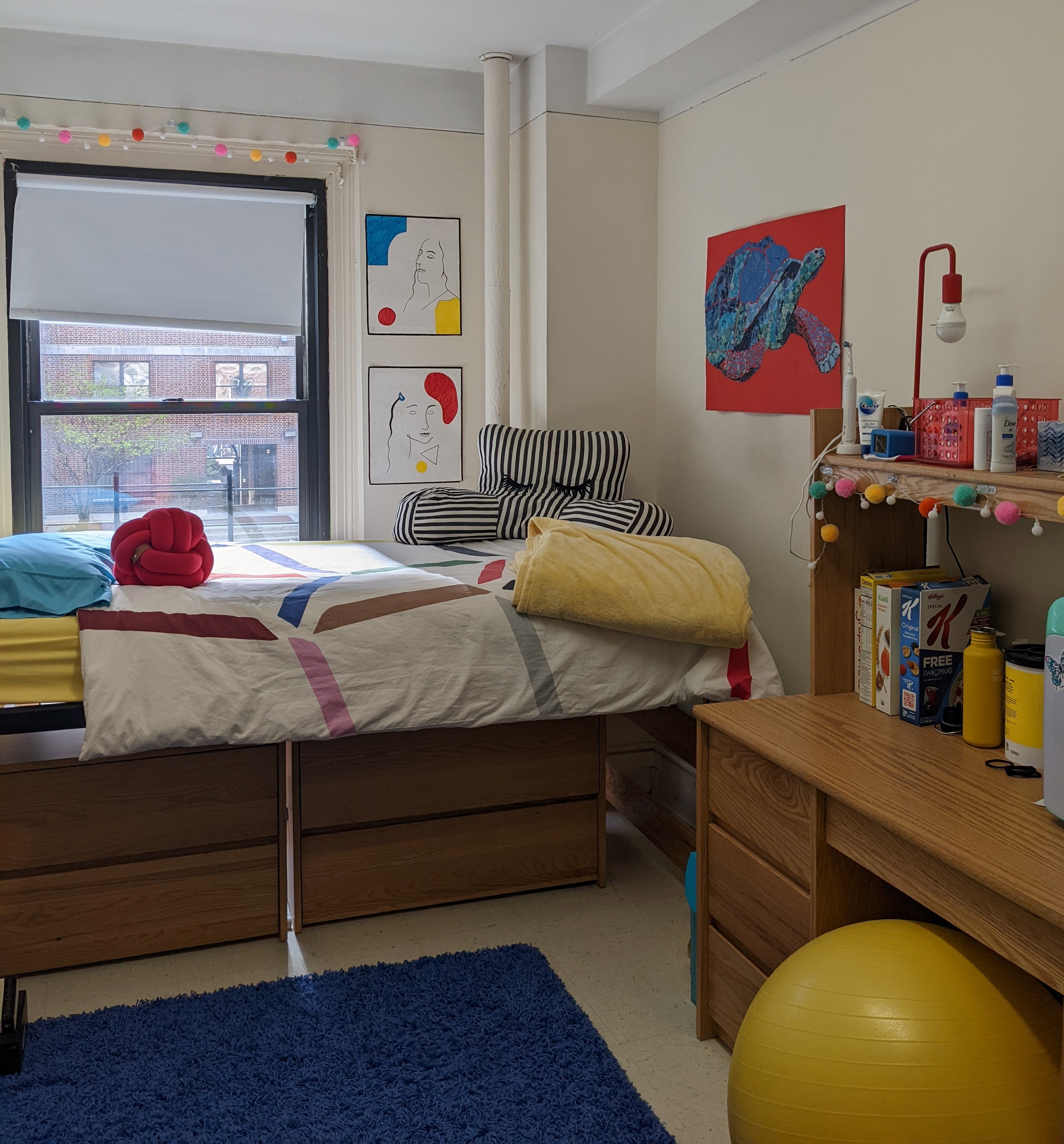 Miranda's freshman dorm room with red, aqua and yellow decor